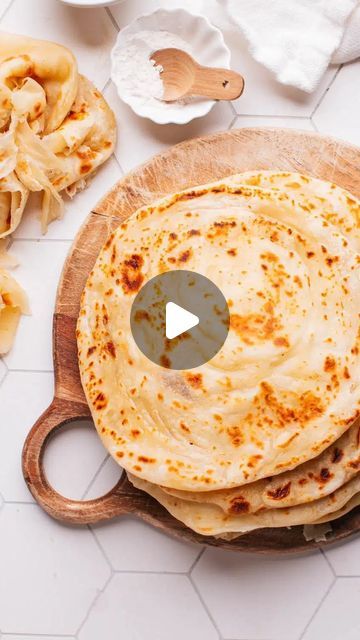 665K views · 24K likes | Jennifer Pallian, BSc RD on Instagram: "Guys, paratha is SO GOOD 👇  Comment “recipe” below and I’ll DM you the full details!  This soft, stretchy South-Indian style flatbread pulls apart into the most irresistible, flaky, buttery layers.   Perfect for scooping up spicy curries 🔥  I’ve been ✨OBSESSED ✨ with perfecting this restaurant favorite since my first trip to India.   The layers are created by brushing the dough with melted butter, coiling it up, then rolling it out. This creates pockets of butter throughout.  Once cooked, the layers puff and make an incredible textural contrast to the soft, stretchy flatbread.  You may also know it as Kerala Parotta, Lachha Paratha, Roti Canai (in Malaysia), Malabar Parotha or Buss Up Shut (in the Caribbean). It goes by so Kerala Parotta, Roti Canai Recipe, Paratha Roti, Lachha Paratha, Roti Canai, Trip To India, Paratha Recipes, Best Comments, Pull Apart