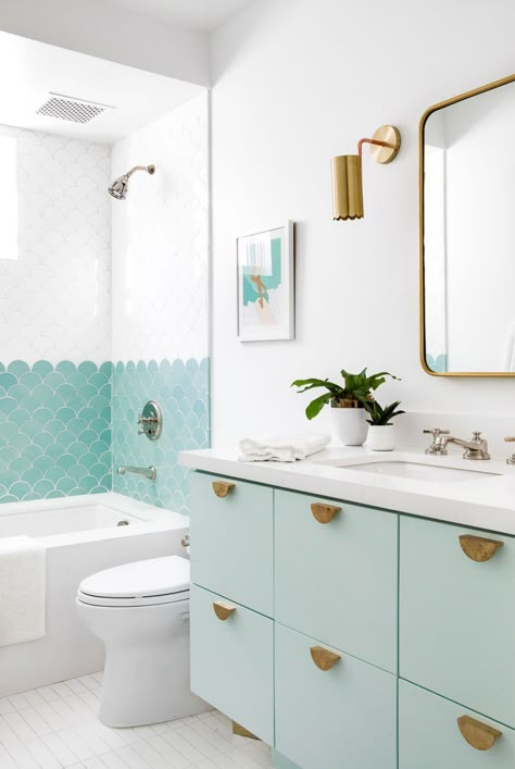 Use timeless neutrals, shades of blue, and subtle nautical accents for a coastal-inspired refresh. #bathrooms #coastalbathrooms #bluebathroom #bhg Mint Green Bathrooms, Mint Bathroom, Midcentury Modern Bathroom, Makeover Kamar Mandi, Coastal Bathrooms, Girls Bathroom, Blue Bathroom, Green Bathroom, Bathroom Renos