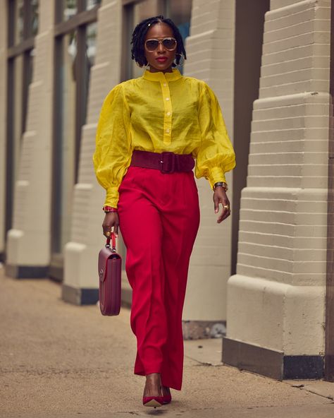 A black woman wearing a bold color-blocked outfit of red pants and a yellow blouse. The look has a wide belt in a wine color, and wine pumps. Red Pants Color Blocking, Colorful Fall Outfits, Mustard Outfits, Contrast Outfit, Fall Fashion Inspiration, Red X, Yellow Shirt, Yellow Outfit, Style Inspiration Fall