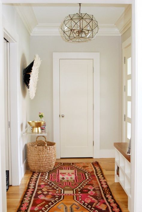 Entryway with patterned red and pink rug and woven basket Bright Hallways, Rug Makeover, Revere Pewter, Honey Oak, Style At Home, Ikea Hacks, Eclectic Home, Oak Floors, Home Fashion