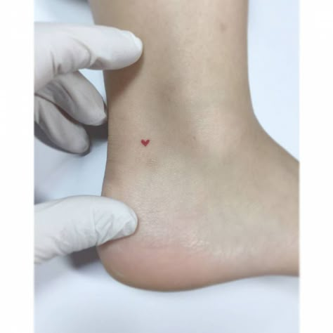 Micro red heart tattoo located on the ankle, Red Heart Tattoo, Heart Tattoo Ankle, Little Heart Tattoos, Jonboy Tattoo, Love Heart Tattoo, Red Heart Tattoos, Tiny Heart Tattoos, Ankle Tattoos For Women, Explore Tattoo