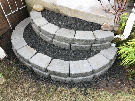 You can make these sturdy curved stairs out of concrete blocks and gravel for secure footing. This is a guide about how to make stacked block stairs. Cinder Block Stairs Outdoor, Landscape Blocks Ideas, Cinder Block Stairs, Concrete Block Steps, Cinder Block Steps, Porch Steps With Landing, Porch Steps With Railing, Trampoline Stairs, Steps With Railing