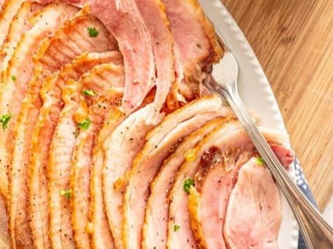 Crockpot Ham - NewsBreak Ham In Crockpot, Meal For A Crowd, Cooking Ham In Crockpot, One Bowl Banana Bread, Bacon Wrapped Green Beans, Slow Cooker Meat, Ham Dishes, Spiral Sliced Ham, Whole Ham