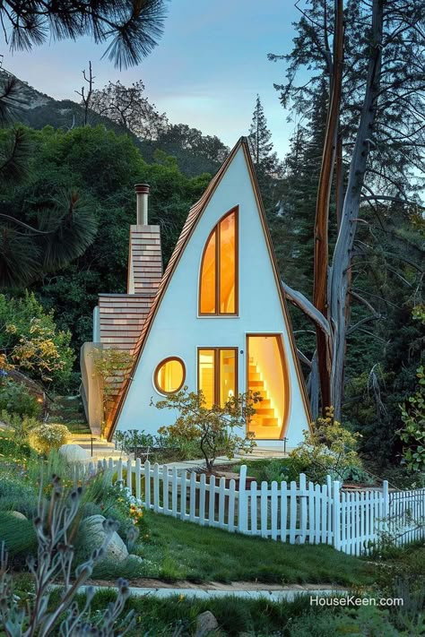 The tiled roof adds a rustic touch, complementing the clean white exterior, while the geometric windows provide architectural interest and flood the interior with natural light. Unique Cottages, Swedish Cottage, Craft Shed, Cottage Designs, Eco Lodge, White Exterior, A Frame Cabin, White Cottage, A Frame House