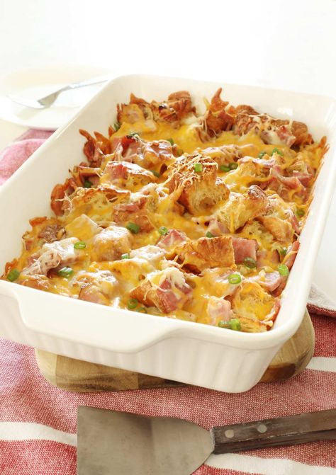 This ham and cheese croissant breakfast casserole is the best way to use your leftover ham. A savory breakfast bake with cubed croissants, ham, cheese and eggs. Croissant Ham And Cheese Casserole, Ham And Cheese Croissant Breakfast Casserole, Cubed Croissants, Ham And Cheese Croissant Casserole, Ham Egg Bake, Holiday Breakfast Casserole, Croissant Casserole, Ham And Egg Casserole, Croissant Breakfast Casserole