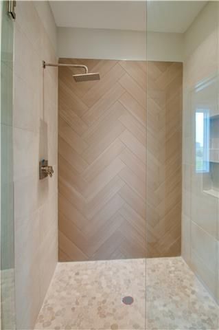 Herringbone Wood Tile Bathroom, Shower Chevron Tile, Wood Look Tile Herringbone Pattern, Wood Bathroom Tile Wall, Wood Slat Look Tile, Master Shower Wood Tile, Marble And Wood Look Tile Bathroom, Wood Plank Shower Tile, Wood Tiled Bathrooms