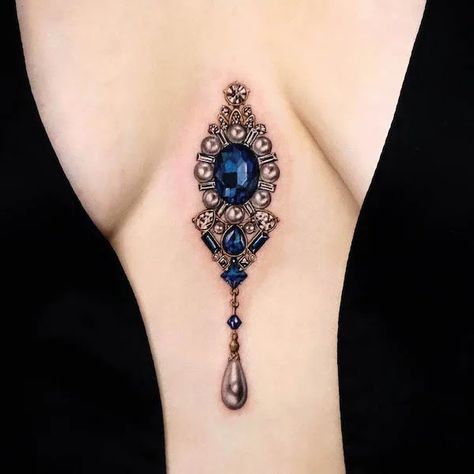 Jeweled Shoulder Tattoo, Sternum Gem Tattoo, Yeriel Tattoo, Jewel Tattoo Gem, Jewel Chest Tattoo, Gemstone Tattoo, Pendant Tattoo, Gold Tattoo Ink, Beautiful Spine Tattoos