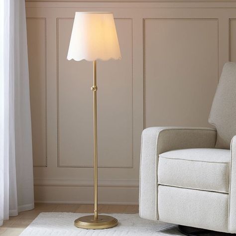 Give their space a charming glow with our Amelia floor lamp. The adjustable height puts light where they need it, while the scalloped shade adds a touch of delicate detail. DETAILS THAT MATTER Cast from iron. Features a hand-applied, oil-based finish in Light Gold. Shade features a linen exterior with a polystyrene interior in White. On/off switch located on in-line; clear cord. Height of lamp is adjustable. Features a weight base. White fabric shade is included. All our shades are designed with an UNO fitter for securing shade to base. KEY PRODUCT POINTS Pottery Barn Kids exclusive. ETL-listed. We created an interactive lighting guide to help you choose the best light for your space. Learn more. Imported. Groovy Floor Lamp, Scalloped Floor Lamp, Boho Nursery Floor Lamp, Floor Lamp Kids Room, Floor Lamp Nursery, Tall Lamps For Living Room, Nursery Floor Lamp, Shabby Chic Floor Lamp, Floor Lamp Ideas