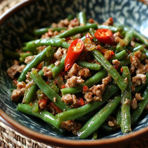 🌶️🥬 Wake up your taste buds with the spicy, creamy flavors of Gising-Gising—perfect for a fiery feast! 😋 #GisingGising #SpicyEats Gising-Gising (Spicy Green Bean Dish) Ingredients: Green beans (Sitaw, 2 cups, chopped) Ground pork (1/2 cup) Coconut milk (1 cup) Garlic (3 cloves, minced) Onion (1, chopped) Red chili (2, chopped) Fish sauce (2 tbsp) Salt and pepper (to taste) Instructions: Sauté garlic, onion, and ground pork in a pan until browned. Add chopped green beans and red chili. Coo... Spicy Chili Recipe Easy, Chili Recipe Stovetop, Spicy Chili Recipe, Green Bean Dishes, Spicy Green Beans, Instagram Recipes, Chile Pepper, Spicy Chili, Trending Recipes