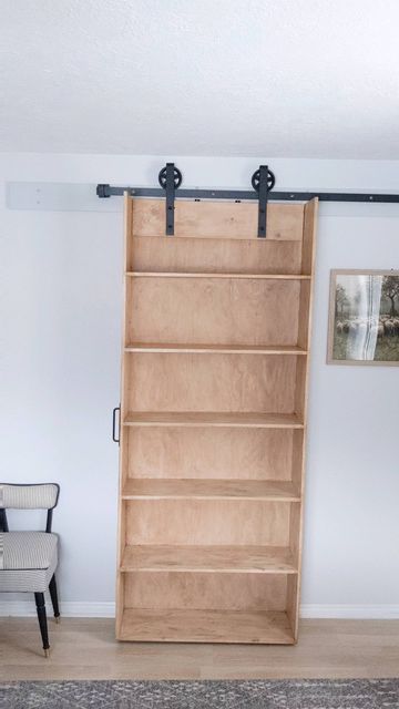 Sliding Bookshelf, Cabinet Colours, Floor To Ceiling Bookshelves, Apartment Must Haves, Bookshelf Door, Trailer Living, Form And Function, Rolling Storage, Closet Door