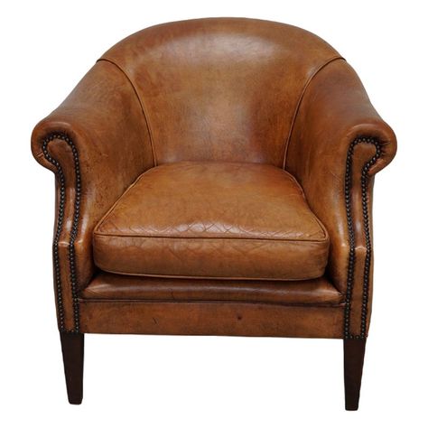 This cognac-colored leather club chair comes from the Netherlands. It is upholstered with cognac-colored leather and features metal rivets and wooden legs. Pub Chairs, Leather Club Chairs, Wooden Leg, Club Chair, Colored Leather, Chairs For Sale, Bits And Bobs, Club Chairs, Rivets