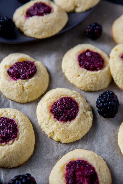 These easy thumbprint cookies turn a classic holiday recipe into a healthier version using fresh blackberries and a low carb shortbread dough. Easy Thumbprint Cookies, Best Thumbprint Cookies, Thumbprint Cookies Easy, Raspberry Thumbprint Cookies, Jam Thumbprint Cookies, Keto Christmas Cookies, Thumbprint Cookies Recipe, Raspberry Cookies, Buttery Shortbread Cookies