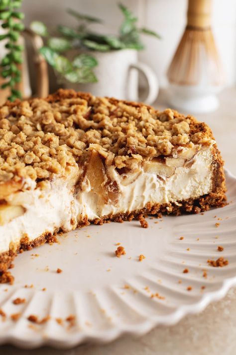 This apple crumble cheesecake is made with a biscoff cookie crust, creamy spiced cheesecake topped with tender cinnamon apples, and a crumble topping. It's the perfect rich and delicious Fall cheesecake! #applecrumble #cheesecake #fallbaking | teakandthyme.com Apple Crumble Cheesecake With Biscoff Crust, Apple Crumble Cheesecake No Bake, No Bake Apple Crumble Cheesecake, Apple Crumb Cheesecake, Spiced Cheesecake, Biscoff Crust, Fall Cheesecake, Apple Crumble Cheesecake, Crumble Cheesecake