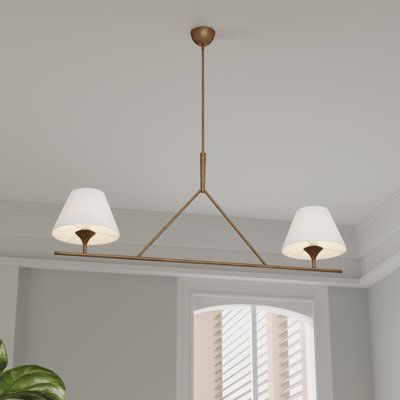 Elevate your eating space or living room with this 2-light linear chandelier. Balancing a luxe feel with classic inspiration, it features a streamlined metal fixture with a sleek finish. At either end, two empire shades surround standard bulb bases, each of which suits a bulb of up to 60W (sold separately). We love that the adjustable length of the download lets you customize the drop to suit your space, while the ambient light direction creates a welcoming atmosphere. To complete the look, simp Linear Island Pendant, Linear Dining Room Chandelier, Cottage Light Fixtures, Linear Light Fixture, Linear Island Lighting, Dining Room Light Fixture, Island Light Fixtures, Cottage Lighting, Beach Lighting