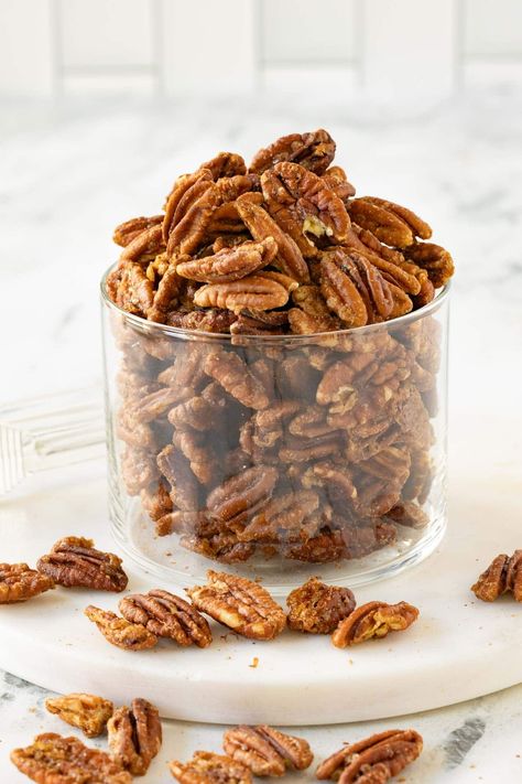 Crunchy and sweet, these maple pecans are made with sweet maple syrup, brown sugar, butter, and warm spices. Perfect for salads, snacking, cheese boards, or even prettily packaged as housewarming gifts. They’re dangerously delicious yet not overly sticky, with lower sugar than many recipes. Make them in just 20 minutes. They’re an easy and irresistible treat you’ll love to share and enjoy. Maple Pecans Roasted, Maple Candied Pecans, Spiced Pecans Recipe, Pecans Candied, Maple Pecans, Cardamom Recipe, Brown Sugar Butter, Maple Candy, Glazed Pecans