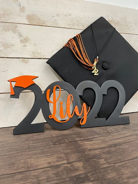 Class of 2022 or Class of 2023 Graduation Sign Personalized with First NameCelebrate your graduate with this custom made photo propparty decorationtable centerpiece or special signSign is black or white with choice of 1 accent color for the name/hatThe overall dimensions measure approximately 14x 6.5High School Graduation College Graduation Trade School Graduation Fall December Graduation Class Of 2023 Graduation Decorations, Graduation Decorations Cricut, Graduation Tables Display, Class Of 2023 Graduation Party Ideas, Centerpieces For Graduation Party, High School Graduation Centerpieces, High School Graduation Decorations, December Graduation, Graduation Decoration Ideas