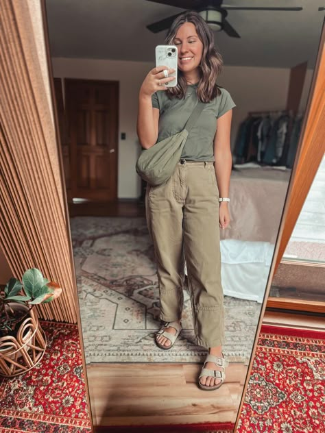 Woman wearing green tee, green crescent bag, and green barrel leg pants taking photo in mirror. Brown hair and smiling Green Cargo Pants Outfit Spring, Green Barrel Pants Outfit, Green Blundstone, Cargo Pants Outfit Spring, Green Tee Outfit, Barrel Pants Outfit, Tapered Pants Outfit, Cargo Pants Outfit Fall, All Green Outfit