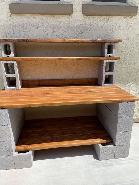 Potting Bench Cinderblock, Cinder Block Potting Bench Ideas, Spray Paint Cinder Blocks, Cinder Block Cooking Station, Cinder Block Work Bench, Cinder Block Tables Outdoor, Cinder Block Garden Bench, Diy Cinder Block Plant Stand, Cinderblock Diy Projects