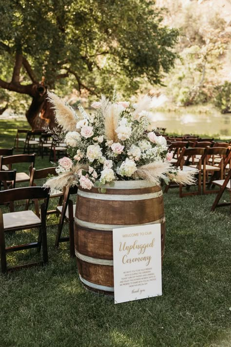 Wedding Flowers On Whiskey Barrels, Wine Barrel Floral Arrangement Wedding, Wedding Florals With Pampas, Rustic Pampas Wedding Decor, Pampas Grass Whiskey Barrel, Boho Barrel Flowers, Pampas Grass Barrel Arrangement, Diy Wine Barrel Flower Arrangement, Barrel Floral Arrangements Wedding