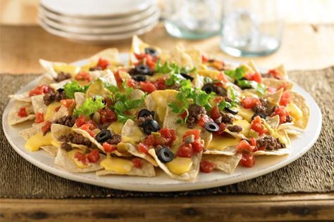 Bring nachos to the next party with nachos recipes! Kraft Recipes has all kinds of nachos recipes from two-bite nacho nibbles to big nachos party platters. Velveeta Nachos, Queso Velveeta, Ultimate Nachos, Velveeta Recipes, Loaded Nachos, Nachos Recipe, Recipes Appetizers And Snacks, Kraft Recipes, Appetizer Dips