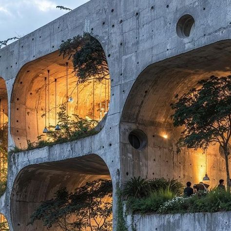 Carlos Bañon Blazquez on Instagram: "/imagine Redefining urban living in Rio, marrying the raw strength of concrete with the delicate balance of nature. It stands as a structure that respects its environment by integrating natural formations and verdure into its very essence. The result is a living space that challenges the urban jungle, replacing it with a vision of what happens when urban design celebrates nature. It’s a bold step towards a future where buildings nurture the environment they inhabit, prompting us to consider how we might all live more harmoniously with the natural world.  Series created using AI techniques. #UrbanSanctuary #NatureMeetsDesign #ModernSanctuary #InnovativeArchitecture #UrbanNatureFusion #EcoUrbanDesign #BiophilicArchitecture #SustainableUrbanism #CityscapeH Plant Building, Nature Environment, Jungle Architecture, Nature Taking Over Buildings, Biophilic Architecture, Urban Spaces Design, Waiting Room Design, Natural Architecture, Urban Zen