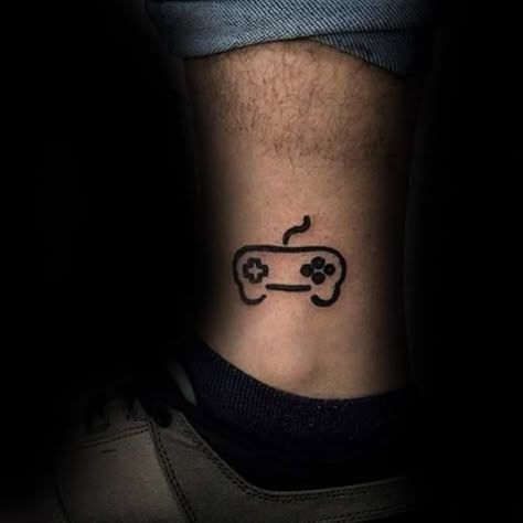 Video Game Controller Mens Simple Tattoo Design Ideas On Legs Small Gaming Tattoos For Men, Gaming Tattoos For Men, Gamer Tattoos Men, Tattoos For Gamers, Ps4 Tattoo, Video Game Tattoo Ideas, Controller Tattoo, Simple Leg Tattoos, Tattoos Leg