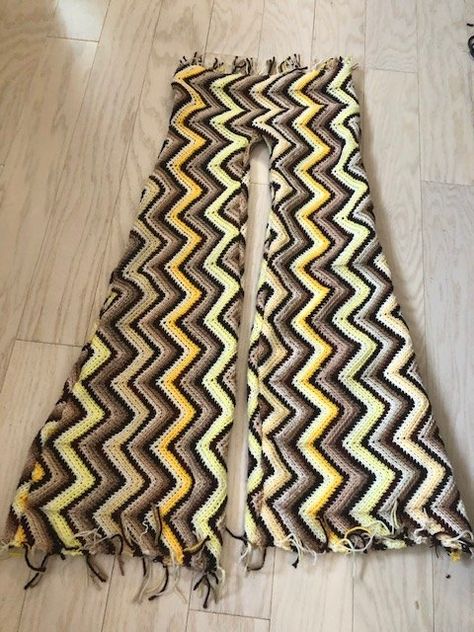 I thrifted this beautiful crochet, chevron blanket which I wanted to upcycle into bell-bottoms- so I gave it a shot! So I folded the blanket lengthwise and placed a pair of leatherette leggings over the fabric as a pattern. I traced along while widening the leg as I got closer to the bottom hem. Once the pattern was cut out, I sewed the pieces together (super easy!). I did this with a thick yellow yarn that was similar to the yellow of the pants- I also used a plastic large eye nee… Crochet Bell Bottoms Free Pattern, Crochet Bell Bottoms, Leatherette Leggings, Crochet Chevron Blanket, Flare Pants Pattern, Washi Dress, Crochet Chevron, Crochet Bell, Chevron Pants