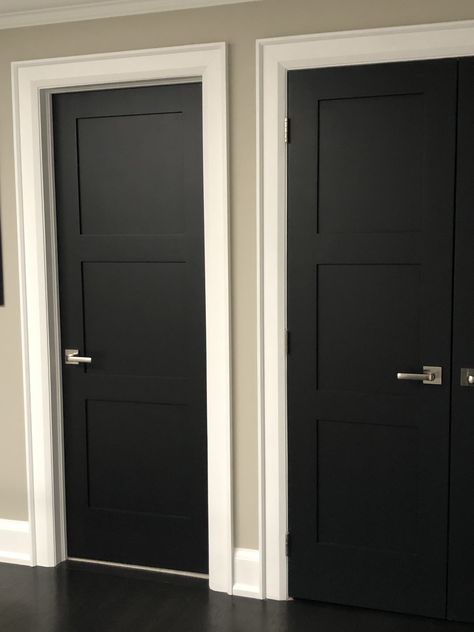 I changed all my doors and decided to paint them blackIt adds elegance to the home and is a bold choice but one I’m very happy with. Graphite Doors Interior, Black Door White Frame, Black Panel Doors Interior, Painting Inside Doors Black, White Trim With Black Doors, Indoor Black Doors, Black Architraves, Black Doors In Hallway, Charcoal Interior Doors