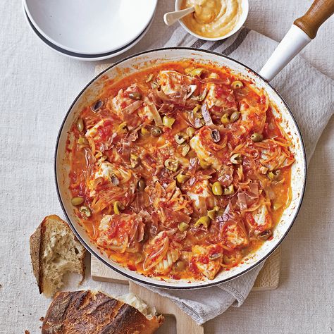 Grating plum tomatoes for Catalan fish stew makes an instant puree. Cooking the tomato puree with serrano ham and olives adds layers of flavors to the... Seafood Main Course, Catfish Stew, Catalan Recipes, Serrano Ham, Seafood Entrees, Mayonnaise Recipe, Tomato Puree, Tomato Relish, Seafood Stew