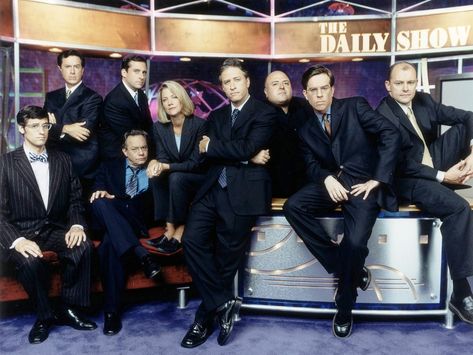 "The Daily Show" season seven promo still, 2002.  L to R: Mo Rocca, Stephen Colbert, Lewis Black, Steve Carell, Nancy Walls, Jon Stewart, Frank DeCaro, Ed Helms, Rob Corddry. Ed Helms, Avengers Theme, Jon Stewart, Steve Carell, The Daily Show, Stephen Colbert, Song Play, Sometimes I Wonder, Comedy Show