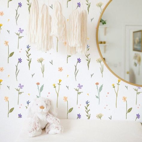 Kid's room with circular mirror, teddy bear, and dresser against wall decorated with delicate flower decals. Wild Flower Nursery, Flowers Decal, Wild Leaves, Cottagecore Bedroom, Floral Wall Decals, Sweet Flowers, Flower Wall Decals, Nursery Room Inspiration, Deco Stickers