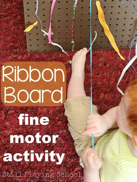 Ribbon Pull Board for Kids: A Fine Motor Activity from Still Playing School Diy Ribbon Crafts, Ribbon Board, Infant Curriculum, Fine Motor Activity, Toddler Classroom, Toddler School, Preschool Fine Motor, Board For Kids, Physical Development