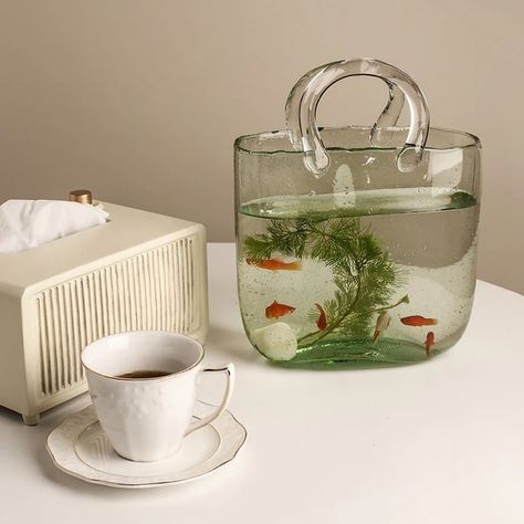 this vase bag reminds me of the coperni glass bag shop here: https://cremecloud.net/products/bag-vase?ref=bb997 or link on my story Bag Flower Vase, Creative Fish Tank, Fish Tank Home, Flower Table Decorations, Glass Bag, Round Gift Boxes, Acrylic Vase, Spring Wedding Decorations, Bag Decoration