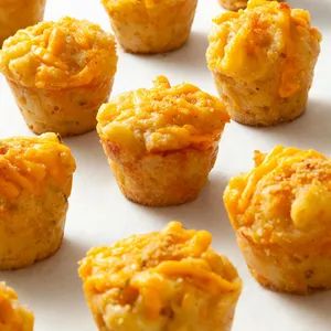 Mac and Cheese Bites Recipe: How to Make It Freezer Sides, Brunch Cups, Mini Mac And Cheese, Kids Friendsgiving, Mac Cheese Balls, Mac Cheese Bites, Vegetarian Finger Food, Football Season Food, Mac N Cheese Bites