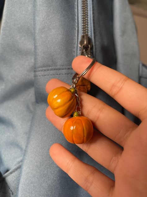 Thank you for choosing our unique keychain! Take a look at this pumpkin keychain, made just on time for the Spooky season. Pumpkin charms made with love and care to add a touch of autumn to your backpack, bag or even used as a wallet keychain. Perfect for gifts for friends, Halloween Gift, Cottagecore decor, Gift for her, Halloween decor.. PRODUCT DETAILS: Materials: Handmade with high-quality clay and painted by hand with durable, vibrant paints.  Coated with UV resin. PROCESSING TIME: The keychain is made to order with a processing time of 3 to 4 days. Shipping times vary based on your location. Check our page for more halloween keychains, Kawaii keychains, Spooky, and halloween themed magnets. PS: items are unique and may have quirks such as glazing pinholes, trapped glazing bubbles and Autumn Gifts Ideas, Polymer Clay Keychains Charms, Fall Keychain Ideas, Halloween Bag Ideas, Mini Clay Ideas Halloween, Clay Charms Ideas, Clay Best Friend Charms, Diy Clay Keychain, Haloween Decoracion Clay