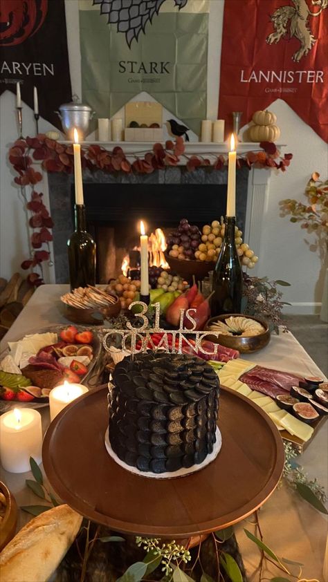 Game of Thrones Birthday Theme Party. I threw my own 31st birthday party and decided on GOT. I custom ordered this dragon scale cake and etsy ordered the cake topping that reads "31 is coming". Did a great food theme of a whole chicken roast, sour breads and cheese platter. Drank red wine and lit candles. Also had the fireplace going with GOT episodes playing in the background. Got Birthday, Game Of Thrones Themed Party, House Of Dragons Party, Game Of Thrones Party Ideas, Game Of Thrones Themed Food, Game Of Thrones Birthday Party Ideas, House Of The Dragon Party, Game Of Thrones Theme Party, Game Of Thrones Party Food