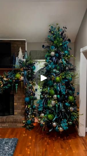 16K reactions · 1.5K shares | I decorated this peacock themed house for Christmas today! I LOVE decorating this house! Love the colors! Love the Levi’s! #merrychristmas2024 #christmaslights #happyholidays #christmasiscoming #ribbon #christmasdecorating #christmasdecorating #christmastree #Christmas #I # | Ben Bland Peacock Christmas Tree Ideas, Peacock Christmas Decorations, Christmas Tree Ribbon Garland, Peacock Christmas Tree, Peacock Wreath, Peacock Christmas, Tree Inspiration, Tree Ribbon, Ribbon Garland