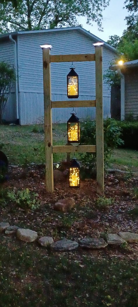 DIY by my son. All solar lights in the lanterns. 4x4 Solar Light Posts, Solar Lamp Posts Front Yard, Diy Solar Lamp Post, Driveway Solar Lights, Diy Solar Garden Lights, Diy Lamp Post Outdoor Solar Lights, Diy Solar Light Post, Solar Yard Lights Ideas, Camping Lot Landscaping Ideas