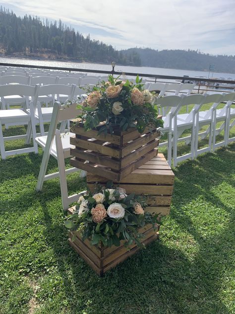 Aisle-ceremony decor using wood crates and blush tone flowers Crates With Flowers, Beginning Of Isle Wedding Decor, Wooden Crates Wedding Decor, Rustic Ceremony Aisle, Rustic Wedding Decor Aisle, Crate Wedding Decorations, Wooden Crates Wedding Ceremony, Milk Crate Wedding Decor, Ceremony Aisle Entrance Decor