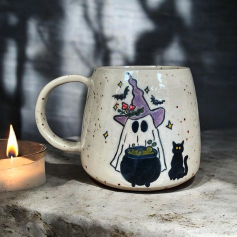 Boo! 🦇🕸️ It’s always halloween season for me ✨🍂 #londonpotters #ceramics #ceramicart #autumn #autumnvibes #stoneware #wheelthrown #coffee #coffeetime #coffeelover #coffeeshop #mug #coffeemug #tableware #pottery #ceramicstudio #ceramiclove #handmadeceramics #beginnerpotter #halloween #londonartist #handmadepottery #mugs #functionalceramics #handthrown #handcrafted #handmademug #pottersofinstagram #wheelthrowing Halloween Mugs Diy, Autumn Mug Painting, Pottery Mugs Painting Ideas, Ceramic Painting Halloween, Halloween Ceramic Painting, Fall Mug Painting Ideas, Pottery Painting Halloween, Funny Pottery Painting Ideas, Fall Pottery Painting Ideas