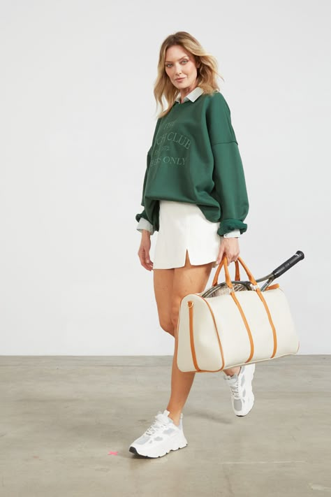 A green oversized sweatshirt paired with a mint striped button up and a sleek white tennis skirt for that preppy-athletic outfit. Green Tennis Outfit, Preppy Tennis Outfit, Preppy Sporty Outfits, Green Tennis Skirt Outfit, Unpolished Casual, Sportwear Outfit Woman, Olympic Outfits, Preppy Work Outfit, Green Tennis Skirt