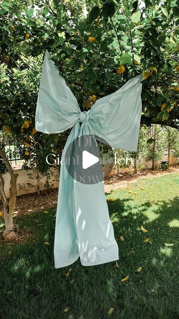 Nicole Flower on Instagram: "Bigger bow DIY 🎀 I used two $1 plastic rectangular tablecloths and voila giant Meri Meri garden party vibes!  #bow #giantbow #easterideas #gardenpartydecor #DIY #makeityourown #merimeri #creativeinspo" Giant Ribbon Bow Diy, Big Bow Decoration, Diy Giant Bow Ribbon, Giant Ribbon Bow, How To Make A Giant Bow, Diy Giant Bow, Large Bow Diy, Big Bows Diy, Giant Bow Diy