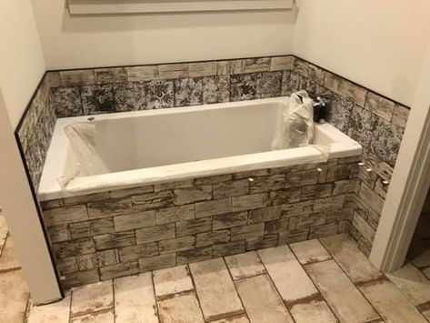 Tub With Stone Surround, Faux Stone Bathtub, Tub With Rock Surround, Stone Bathtub Shower Combo, Bathtub With Stones Around, Industrial Chic Interior, Corner Tub With Brick Backsplash, Stone Tub, Diy Bathtub