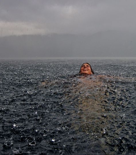 Swimming in the Rain - Lago Caburgua, Chile. Photo by Camila Massu Ocean Swim Aesthetic, Swimming In Nature, Ocean Swimming Aesthetic, Sea Swimming Aesthetic, Floating In Ocean, Favourite Aesthetic, Photos In The Rain, Floating In The Ocean, Swimming Ocean