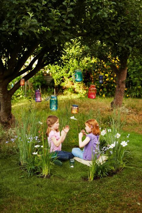 15 magical fairy gardens for kids including one kids can actually get INSIDE. I love the wagon turned fairy garden, too! Outdoor Kids Play Area, Garden Ring, Hgtv Garden, Play Garden, Trees And Flowers, Fairy Lanterns, Fairy Ring, Faeries Gardens, Children's Garden