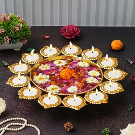 Webelkart Premium Diya Shape Gold Plated Decorative Urli Bowl with Wax Candle for Home Decor Handcrafted Bowl Floating Flowers and Tea Light Candles for Diwali Decoration Items (14.17 Inches) About this item 👉Package Content: 1 Webelkart Gold Plated Round Flower Decoration Urli Bowl Lotus Tealight Candle Holder For Home Decor 👉Metallic Finish: The excellent artefacts come in a metallic finish to brighten up your space with its brilliant details and design. The metallic finish adds to the bea... Urli Bowl, Diwali Decoration Items, Diwali Decor, Floating Flowers, Diwali Decorations, Tealight Candle Holders, Wax Candle, Tea Light Candles, Candle Wax