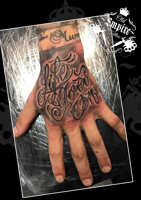 Did this #Lettering #Tattoo covering the hand. The client sat very well! #LifeGoesOn #Script #Quotation #BlackandGrey #CleanLines #HandTattoo #Coils4Life #OldEmpireTattoo #OET #LittleHulton #Walkden Men’s Hand Tattoos Writing, Life Goes On Hand Tattoo, Hand Tattoos For Guys Writing, Hand Tattoo Text Men, Hand Tattoos For Guys Words, Hand Script Tattoo, Tattoo Handwriting Fonts, Tattoo Covering, Crossed Arrow Tattoos