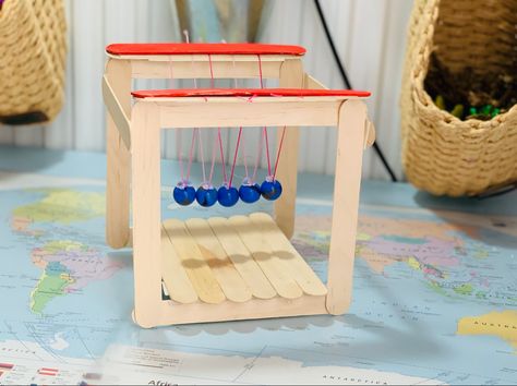 Newtons Cradle Diy, Science Toys Diy, Science Vbs, Homeschooling Crafts, Newton's Cradle, Halloween Arts, Famous Scientist, Science Crafts, Homeschool Crafts