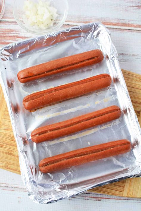 Sheet pan hot dogs in the oven frozen or fresh. Easy way to make lunch in bulk quickly! Roasted plump Oscar Mayer or Hebrew National wieners. Cook Hot Dogs In Oven, How To Cook Hotdogs In The Oven, Oven Hot Dogs Baking, Broiled Hot Dogs In Oven, Christmas Hot Dogs For Kids, Oven Roasted Hot Dogs, Cooking Hot Dogs In Oven, Roasted Hot Dogs In The Oven, How Long To Bake Hot Dogs In The Oven