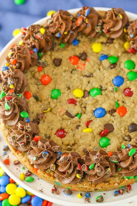 This Monster Cookie Cake is full of M&Ms, chocolate chips, peanut butter and oats for a cookie cake that is fun, chewy and delicious! Easy to make and perfect for sharing!  (more…) The post Monster Co Monster Cookie Cake, Kids Party Desserts, Chocolate Chip Cookie Cake Recipe, Cookie Cake Designs, Monster Cookie, Chocolate Chip Cookie Cake, Giant Cookie, Cookie Cake Recipe, Dessert Party